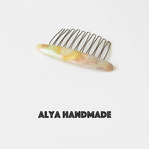 Marble patterned iron toothed hair comb