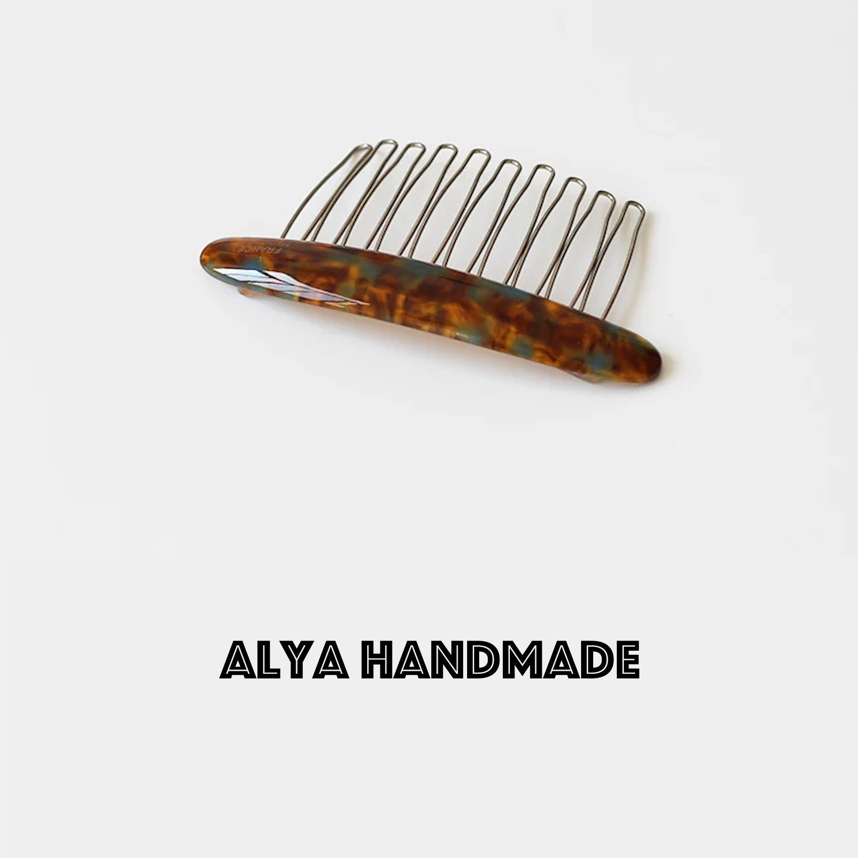 Marble patterned iron toothed hair comb