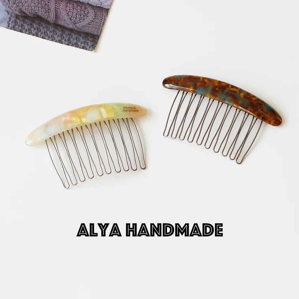 Marble patterned iron toothed hair comb